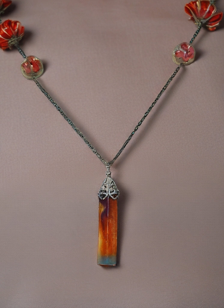 Resin pendant necklace with stud flower earrings.
