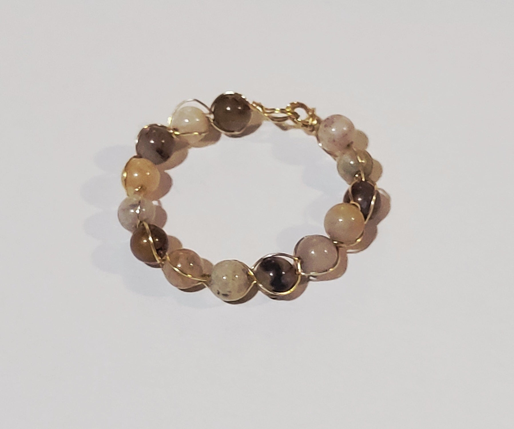 Ring with multi-colored, woven beads