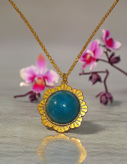 Gold necklace with blue pendant